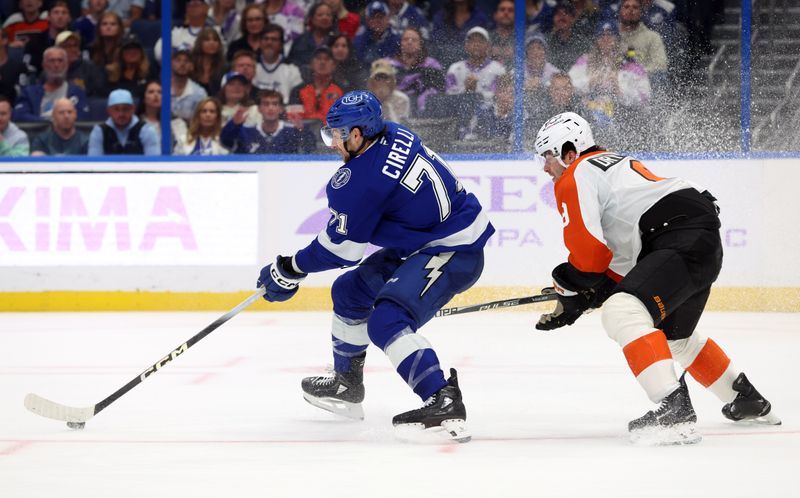 Nov 24, 2025; Tampa, Florida, USA; Tampa Bay Lightning center Anthony Cirelli (71) skates with the puck as Philadelphia Flyers defenseman Jamie Drysdale (9) defends during the third period at Benchmark International Arena. Mandatory Credit: Kim Klement Neitzel-Imagn Images
