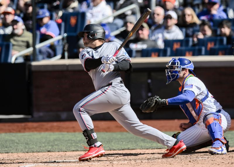 Apr 9, 2025; New York City, New York, USA; Miami Marlins first baseman Jonah Bride (41) hits a RBI single against the New York Mets during the ninth inning at Citi Field. Mandatory Credit: John Jones-Imagn Images