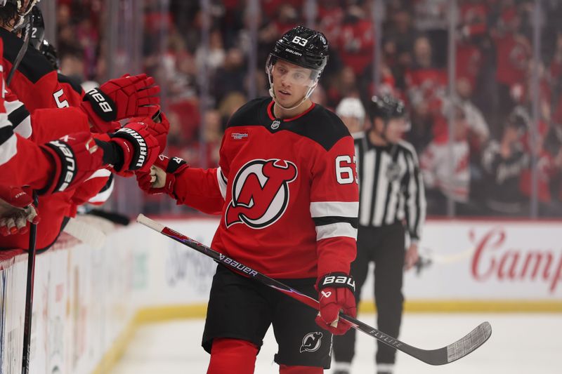 Jan 3, 2026; Newark, New Jersey, USA; New Jersey Devils left wing Jesper Bratt (63) celebrates his goal against the Utah Mammoth during the first period at Prudential Center. Mandatory Credit: Ed Mulholland-Imagn Images