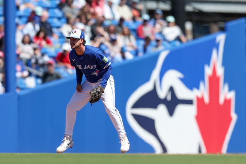 Mar 21, 2025; Dunedin, Florida, USA; Toronto Blue Jays third baseman Ernie Clement (22) waits for a play against the Philadelphia Phillies in the sixth inning during spring training at TD Ballpark. Mandatory Credit: Nathan Ray Seebeck-Imagn Images