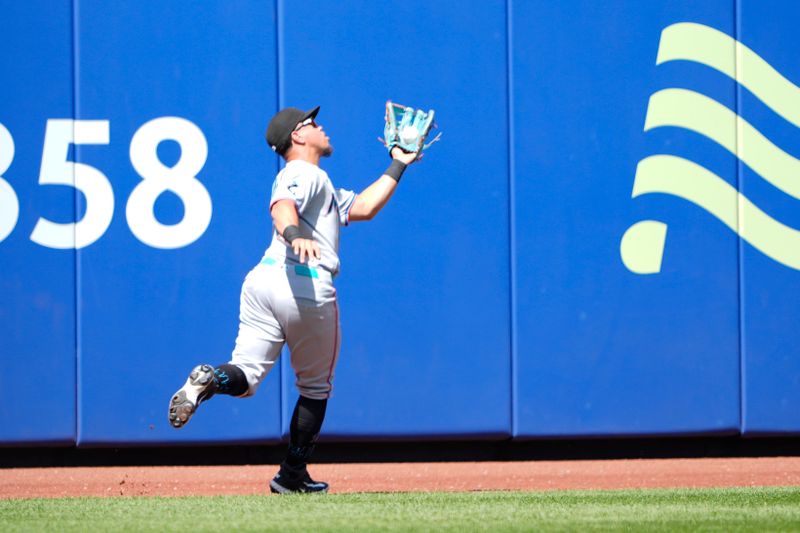 Aug 31, 2025; New York City, New York, USA; Miami Marlins left fielder Heriberto Hernandez (64) catches a fly ball hit by New York Mets shortstop Francisco Lindor (12) (not pictured) during the first inning at Citi Field. Mandatory Credit: Gregory Fisher-Imagn Images