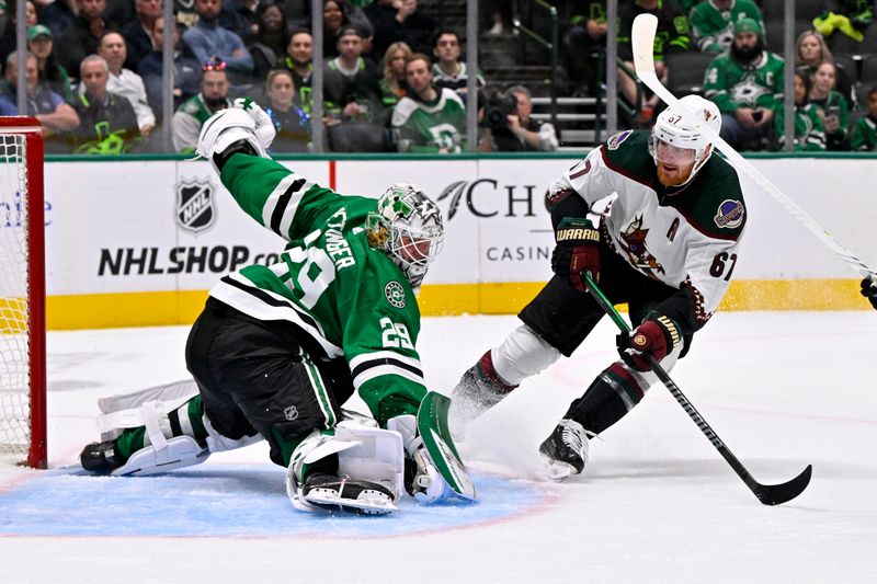 Nov 14, 2023; Dallas, Texas, USA; Arizona Coyotes left wing Lawson Crouse (67) scores a goal against Dallas Stars goaltender Jake Oettinger (29) during the third period at the American Airlines Center. Mandatory Credit: Jerome Miron-USA TODAY Sports