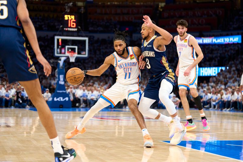 OKLAHOMA CITY, OKLAHOMA - APRIL 21: Isaiah Joe #11 of the Oklahoma City Thunder drives to the basket against the New Orleans Pelicans in game one of the Western Conference First Round Playoffs at the Paycom Center on April 21, 2024 in Oklahoma City, Oklahoma. NOTE TO USER: User expressly acknowledges and agrees that, by downloading and or using this photograph, User is consenting to the terms and conditions of the Getty Images License Agreement.  (Photo by Cooper Neill/Getty Images)