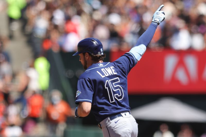 Aug 16, 2023; San Francisco, California, USA; Tampa Bay Rays right fielder Josh Lowe (15) hits a one run home run during the fourth inning against the San Francisco Giants at Oracle Park. Mandatory Credit: Sergio Estrada-USA TODAY Sports