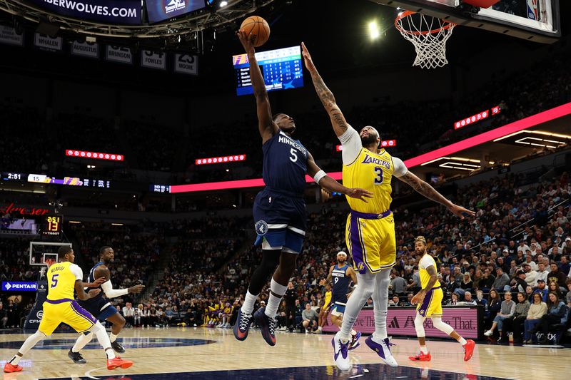 MINNEAPOLIS, MINNESOTA - DECEMBER 13: Anthony Edwards #5 of the Minnesota Timberwolves goes up for a shot against Anthony Davis #3 of the Los Angeles Lakers in the first quarter at Target Center on December 13, 2024 in Minneapolis, Minnesota. NOTE TO USER: User expressly acknowledges and agrees that, by downloading and or using this photograph, User is consenting to the terms and conditions of the Getty Images License Agreement. (Photo by David Berding/Getty Images)