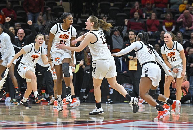 Mar 10, 2023; Kansas City, MO, USA;  Oklahoma State Cowgirls guard Terryn Milton (21) reacts with her teammates after scoring the winning basket during the second half at Municipal Auditorium. Mandatory Credit: Peter Aiken-USA TODAY Sports