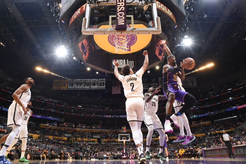 LOS ANGELES, CA - JANUARY 19:  LeBron James #23 of the Los Angeles Lakers passes the ball during the game on January 19, 2024 at Crypto.Com Arena in Los Angeles, California. NOTE TO USER: User expressly acknowledges and agrees that, by downloading and/or using this Photograph, user is consenting to the terms and conditions of the Getty Images License Agreement. Mandatory Copyright Notice: Copyright 2024 NBAE (Photo by Adam Pantozzi/NBAE via Getty Images)