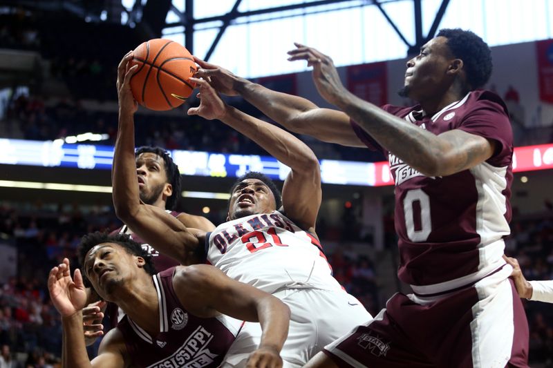 Feb 18, 2023; Oxford, Mississippi, USA; Mississippi State Bulldogs guard Eric Reed Jr. (left), forward D.J. Jeffries (0) and Mississippi Rebels forward Robert Allen (21) battle for a rebound during the second half at The Sandy and John Black Pavilion at Ole Miss. Mandatory Credit: Petre Thomas-USA TODAY Sports