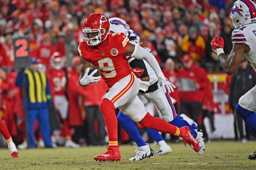 Kansas City Chiefs wide receiver JuJu Smith-Schuster (9) runs with the ball after catching a pass during the AFC Championship NFL football game against the Buffalo Bills Sunday, Jan. 26, 2025, in Kansas City, Mo. (AP Photo/Peter Aiken)