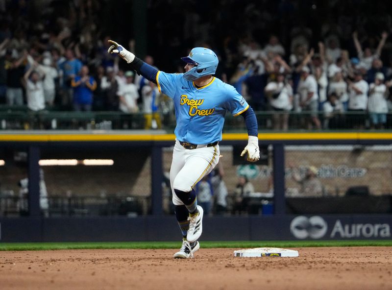 Jun 7, 2025; Milwaukee, Wisconsin, USA; Milwaukee Brewers third base Caleb Durbin (21) celebrates hitting a walk off home run agains the San Diego Padres in the ninth inning at American Family Field. Final Milwaukee Brewers 5, San Diego Padres 3. Mandatory Credit: Michael McLoone-Imagn Images