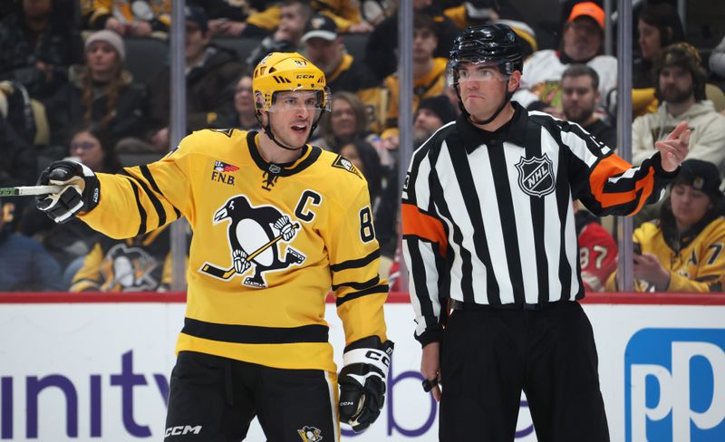 Jan 29, 2026; Pittsburgh, Pennsylvania, USA;  Pittsburgh Penguins center Sidney Crosby (87) reacts to referee Furman South (13) against the Chicago Blackhawks during the second period at PPG Paints Arena. Mandatory Credit: Charles LeClaire-Imagn Images