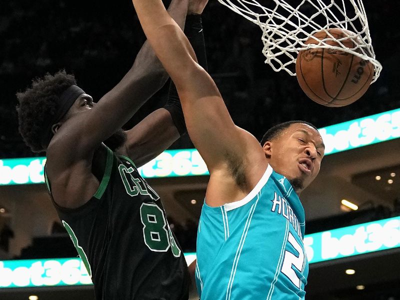 CHARLOTTE, NORTH CAROLINA - NOVEMBER 02: Neemias Queta #88 of the Boston Celtics dunks over Grant Williams #2 of the Charlotte Hornets during the second half of the game at Spectrum Center on November 02, 2024 in Charlotte, North Carolina. NOTE TO USER: User expressly acknowledges and agrees that, by downloading and or using this photograph, User is consenting to the terms and conditions of the Getty Images License Agreement.  (Photo by Grant Halverson/Getty Images)