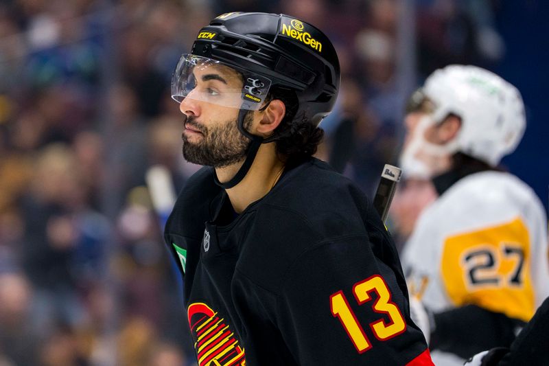 Oct 26, 2024; Vancouver, British Columbia, CAN; Vancouver Canucks forward Arshdeep Bains (13) during a stop in play against the Pittsburgh Penguins during the third period at Rogers Arena. Mandatory Credit: Bob Frid-Imagn Images