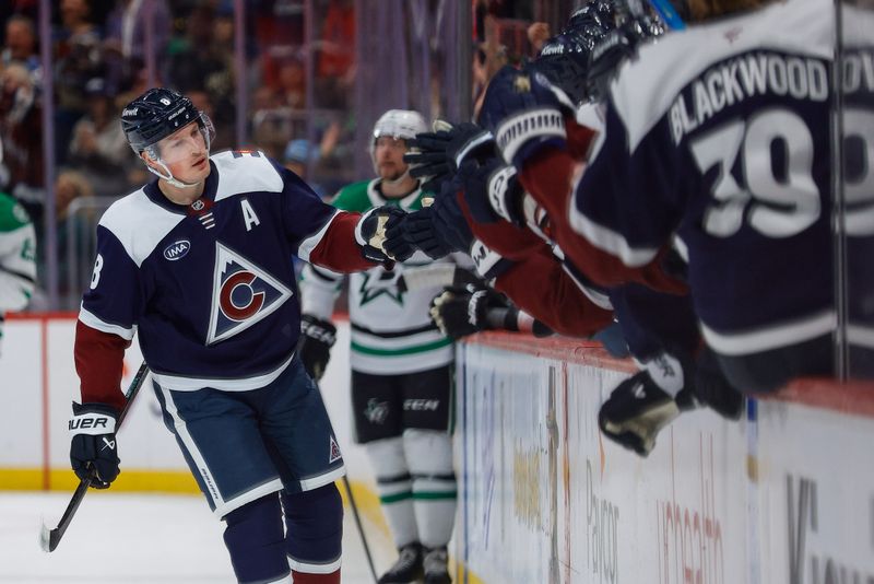 Mar 18, 2026; Denver, Colorado, USA; Colorado Avalanche defenseman Cale Makar (8) celebrates with the bench after his goal in the first period against the Dallas Stars at Ball Arena. Mandatory Credit: Isaiah J. Downing-Imagn Images