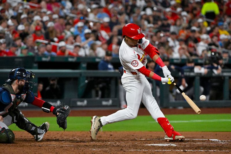 May 17, 2024; St. Louis, Missouri, USA;  St. Louis Cardinals shortstop Masyn Winn (0) hits a two run home run against the Boston Red Sox during the sixth inning at Busch Stadium. Mandatory Credit: Jeff Curry-USA TODAY Sports