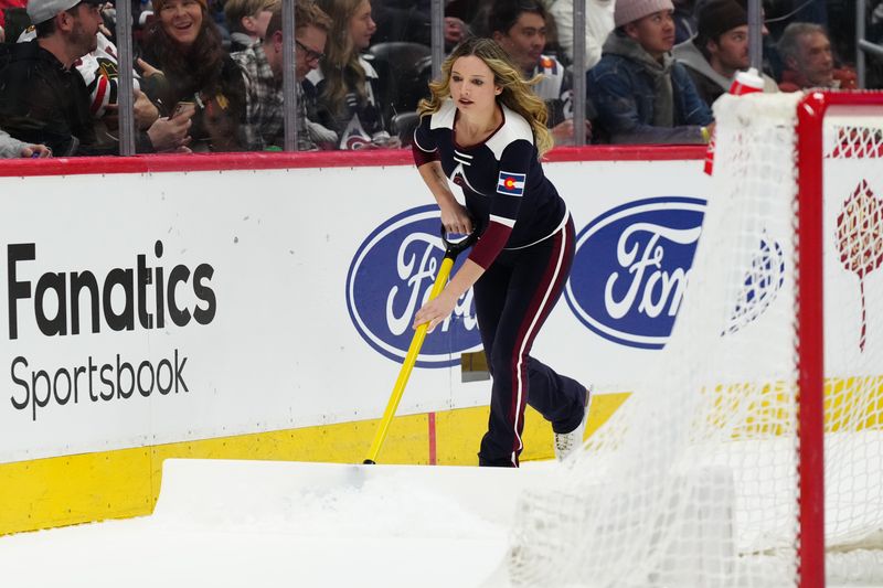 Mar 4, 2024; Denver, Colorado, USA; Colorado Avalanche ice patrol clears the rink in the third period against the Chicago Blackhawks at Ball Arena. Mandatory Credit: Ron Chenoy-USA TODAY Sports