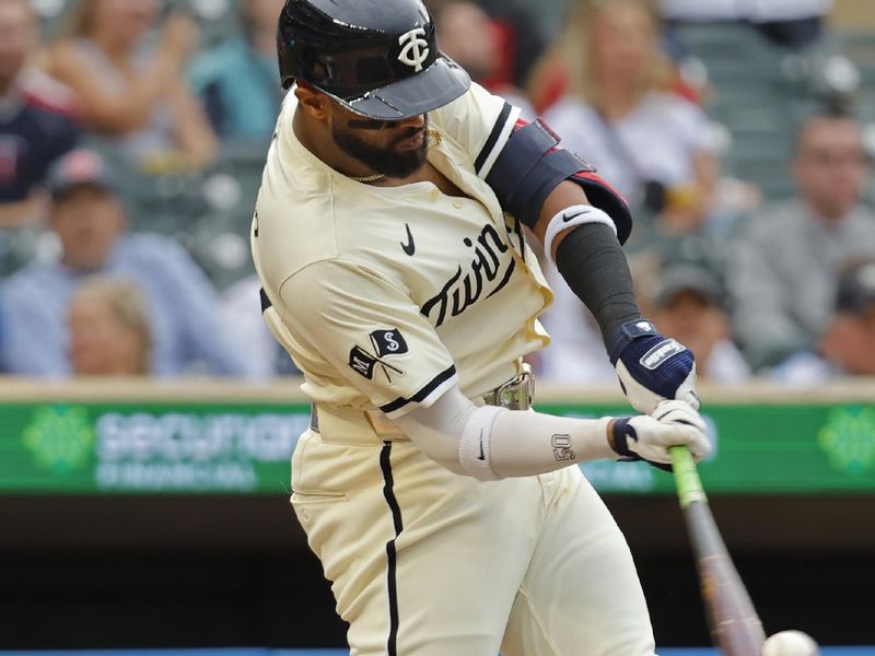 Jun 12, 2024; Minneapolis, Minnesota, USA; Minnesota Twins left fielder Willi Castro (50) hits a solo home run against the Colorado Rockies in the fourth inning at Target Field. Mandatory Credit: Bruce Kluckhohn-USA TODAY Sports