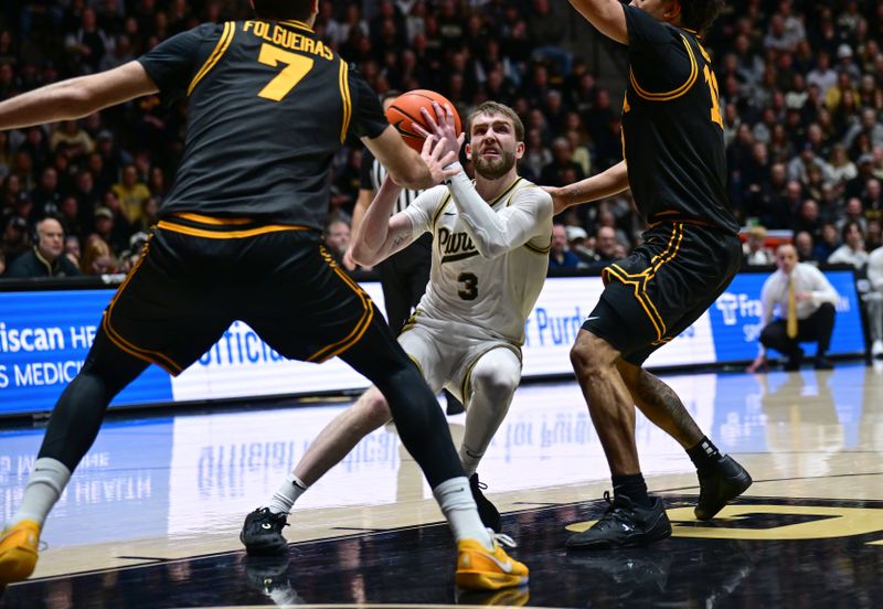 Jan 14, 2026; West Lafayette, Indiana, USA;  Purdue Boilermakers guard Braden Smith (3) shoots a ball in front of Iowa Hawkeyes forward Alvaro Folgueiras (7) during the second half at Mackey Arena. Mandatory Credit: Marc Lebryk-Imagn Images