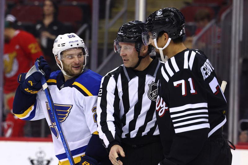 Nov 27, 2024; Newark, New Jersey, USA; St. Louis Blues left wing Nathan Walker (26) and New Jersey Devils defenseman Jonas Siegenthaler (71) argue during the third period at Prudential Center. Mandatory Credit: Ed Mulholland-Imagn Images