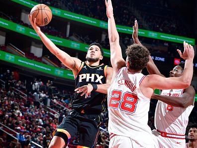 HOUSTON, TX - DECEMBER 27:   Devin Booker #1 of the Phoenix Suns drives to the basket during the game against the Houston Rockets on December 27, 2023 at the Toyota Center in Houston, Texas. NOTE TO USER: User expressly acknowledges and agrees that, by downloading and or using this photograph, User is consenting to the terms and conditions of the Getty Images License Agreement. Mandatory Copyright Notice: Copyright 2023 NBAE (Photo by Logan Riely/NBAE via Getty Images)