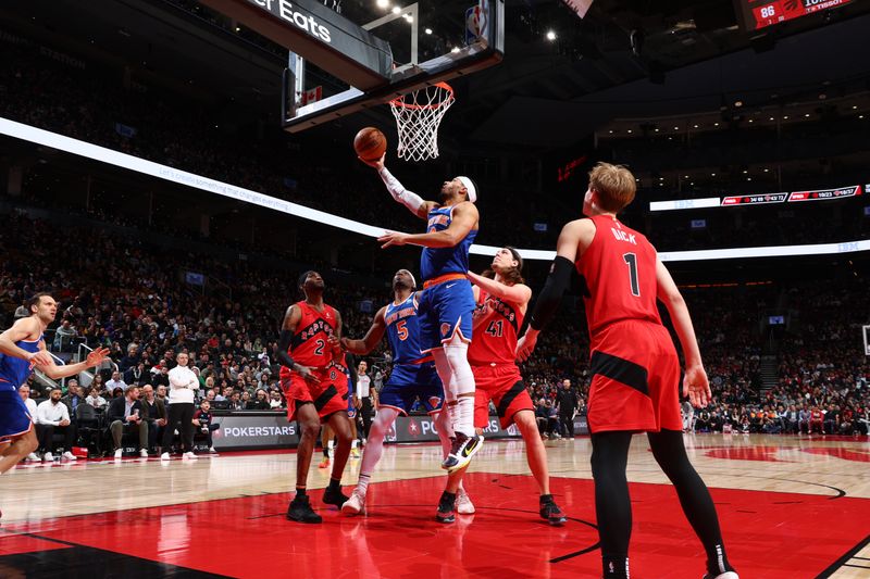 TORONTO, CANADA - MARCH 27: Josh Hart #3 of the New York Knicks drives to the basket during the game against the Toronto Raptors on March 27, 2024 at the Scotiabank Arena in Toronto, Ontario, Canada.  NOTE TO USER: User expressly acknowledges and agrees that, by downloading and or using this Photograph, user is consenting to the terms and conditions of the Getty Images License Agreement.  Mandatory Copyright Notice: Copyright 2024 NBAE (Photo by Vaughn Ridley/NBAE via Getty Images)