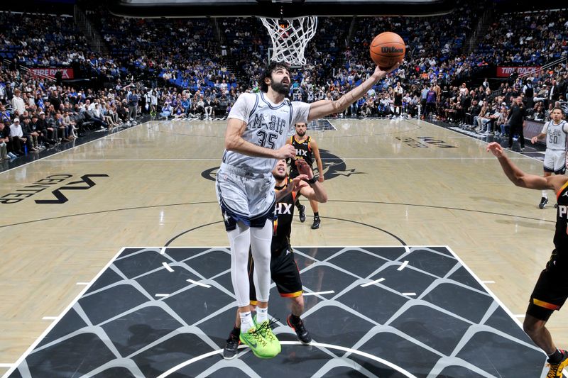 ORLANDO, FL - DECEMBER 8: Goga Bitadze #35 of the Orlando Magic shoots the ball during the game against the Phoenix Suns on December 8, 2024 at Amway Center in Orlando, Florida. NOTE TO USER: User expressly acknowledges and agrees that, by downloading and or using this photograph, User is consenting to the terms and conditions of the Getty Images License Agreement. Mandatory Copyright Notice: Copyright 2024 NBAE (Photo by Fernando Medina/NBAE via Getty Images)