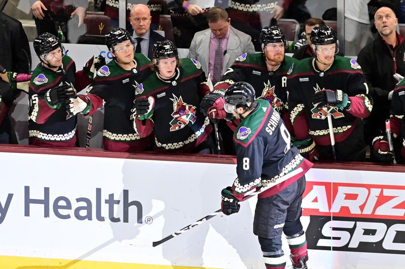 Nov 2, 2023; Tempe, Arizona, USA;  Arizona Coyotes center Nick Schmaltz (8) celebrates with teammates after scoring on a penalty shot in the first period against the Montreal Canadiens at Mullett Arena. Mandatory Credit: Matt Kartozian-USA TODAY Sports