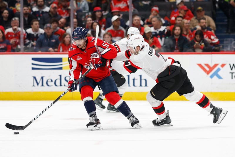 Feb 26, 2024; Washington, District of Columbia, USA; Washington Capitals defenseman Trevor van Riemsdyk (57) skates with the puck as Ottawa Senators left wing Brady Tkachuk (7) defends in the second period at Capital One Arena. Mandatory Credit: Geoff Burke-USA TODAY Sports