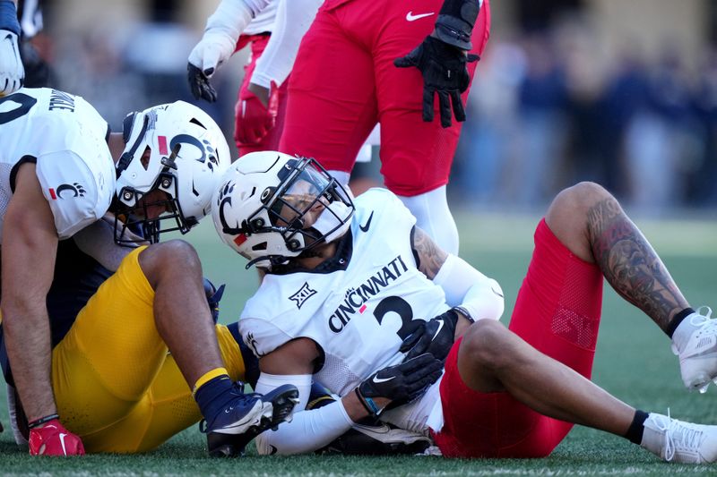 Nov 18, 2023; Morgantown, West Virginia, USA; Cincinnati Bearcats safety Deshawn Pace (3) reacts after suffering an apparent injury in the first quarter against the West Virginia Mountaineers at Milan Puskar Stadium.  Mandatory Credit: Kareem Elgazzar-USA TODAY Sports