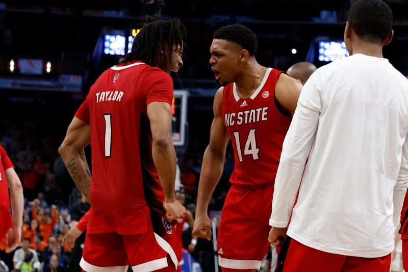 Mar 15, 2024; Washington, D.C., USA; North Carolina State Wolfpack guard Casey Morsell (14) celebrates with North Carolina State Wolfpack guard Jayden Taylor (1) in the second half at Capital One Arena. Mandatory Credit: Geoff Burke-USA TODAY Sports