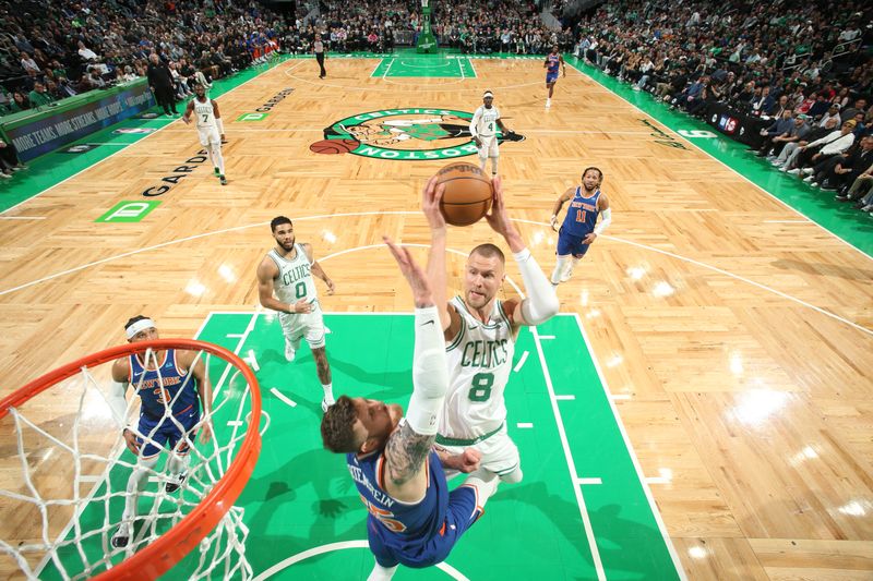 BOSTON, MA - APRIL 11: Kristaps Porzingis #8 of the Boston Celtics drives to the basket during the game against the New York Knicks on April 11, 2024 at the TD Garden in Boston, Massachusetts. NOTE TO USER: User expressly acknowledges and agrees that, by downloading and or using this photograph, User is consenting to the terms and conditions of the Getty Images License Agreement. Mandatory Copyright Notice: Copyright 2024 NBAE  (Photo by Nathaniel S. Butler/NBAE via Getty Images)