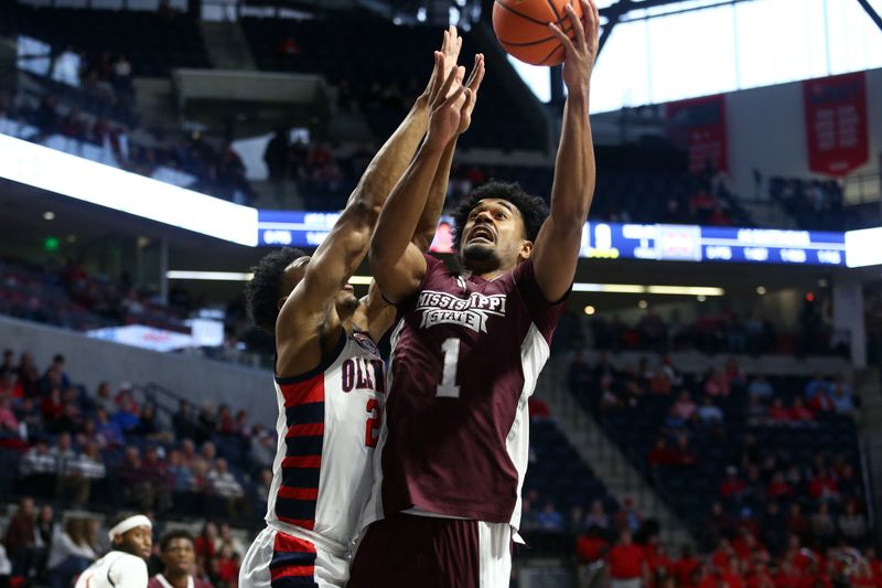 Feb 18, 2023; Oxford, Mississippi, USA; Mississippi State Bulldogs forward Tolu Smith (1) drives to the basket as Mississippi Rebels forward Robert Allen (21) defends during the first half at The Sandy and John Black Pavilion at Ole Miss. Mandatory Credit: Petre Thomas-USA TODAY Sports