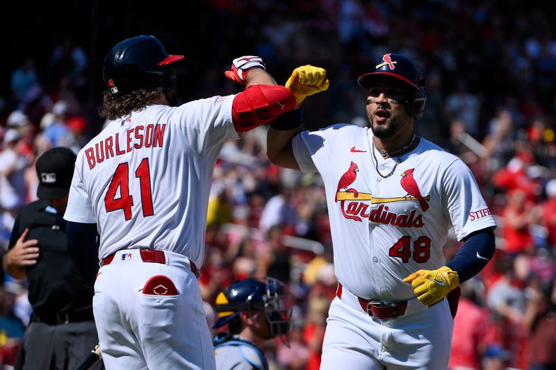 Sep 21, 2025; St. Louis, Missouri, USA; St. Louis Cardinals designated hitter Ivan Herrera (48) celebrates with first baseman Alec Burleson (41) after hitting a two run home run against the Milwaukee Brewers during the third inning at Busch Stadium. Mandatory Credit: Jeff Curry-Imagn Images