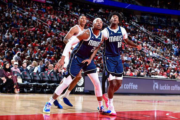 HOUSTON, TX - DECEMBER 22:   Richaun Holmes #20  and Olivier Maxence-Prosper #18 of the Dallas Mavericks look for a rebound during the game against the Houston Rockets on December 22, 2023 at the Toyota Center in Houston, Texas. NOTE TO USER: User expressly acknowledges and agrees that, by downloading and or using this photograph, User is consenting to the terms and conditions of the Getty Images License Agreement. Mandatory Copyright Notice: Copyright 2023 NBAE (Photo by Logan Riely/NBAE via Getty Images)