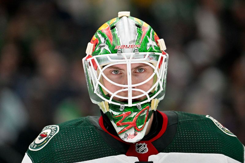 Jan 10, 2024; Dallas, Texas, USA; Minnesota Wild goaltender Jesper Wallstedt (30) waits for play to rums against the Dallas Stars during the second period at the American Airlines Center. Mandatory Credit: Jerome Miron-USA TODAY Sports