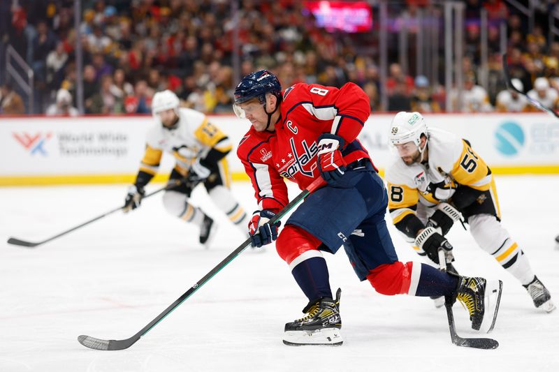 Apr 4, 2024; Washington, District of Columbia, USA; Washington Capitals left wing Alex Ovechkin (8) skates with the puck as Pittsburgh Penguins defenseman Kris Letang (58) defends in the third period at Capital One Arena. Mandatory Credit: Geoff Burke-USA TODAY Sports