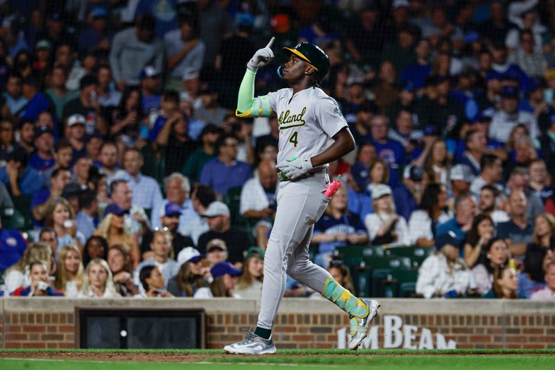 Sep 17, 2024; Chicago, Illinois, USA; Oakland Athletics outfielder Lawrence Butler (4) crosses home plate after hitting a solo home run against the Chicago Cubs during the third inning at Wrigley Field. Mandatory Credit: Kamil Krzaczynski-Imagn Images