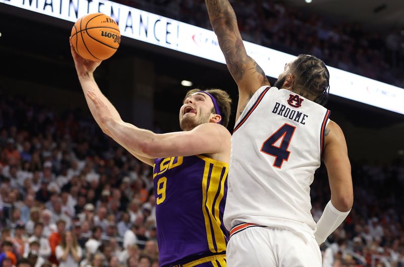 Jan 13, 2024; Auburn, Alabama, USA; LSU Tigers forward Will Baker (9) goes for a shot against Auburn Tigers forward Johni Broome (4) during the first half at Neville Arena. Mandatory Credit: John Reed-USA TODAY Sports