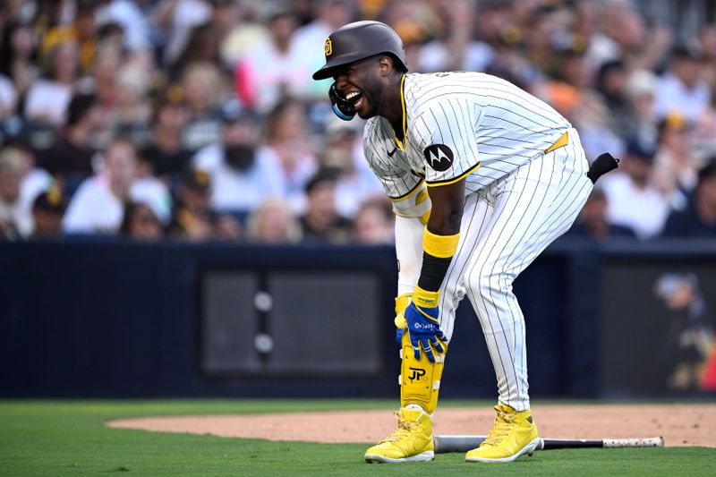 Aug 13, 2024; San Diego, California, USA; San Diego Padres left fielder Jurickson Profar (10) reacts after being hit by a pitch during the first inning against the Pittsburgh Pirates at Petco Park. Mandatory Credit: Orlando Ramirez-USA TODAY Sports