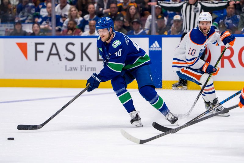 May 16, 2024; Vancouver, British Columbia, CAN; Edmonton Oilers forward Derek Ryan (10) watches Vancouver Canucks forward Elias Pettersson (40) handle the puck during the third period in game five of the second round of the 2024 Stanley Cup Playoffs at Rogers Arena. Mandatory Credit: Bob Frid-USA TODAY Sports