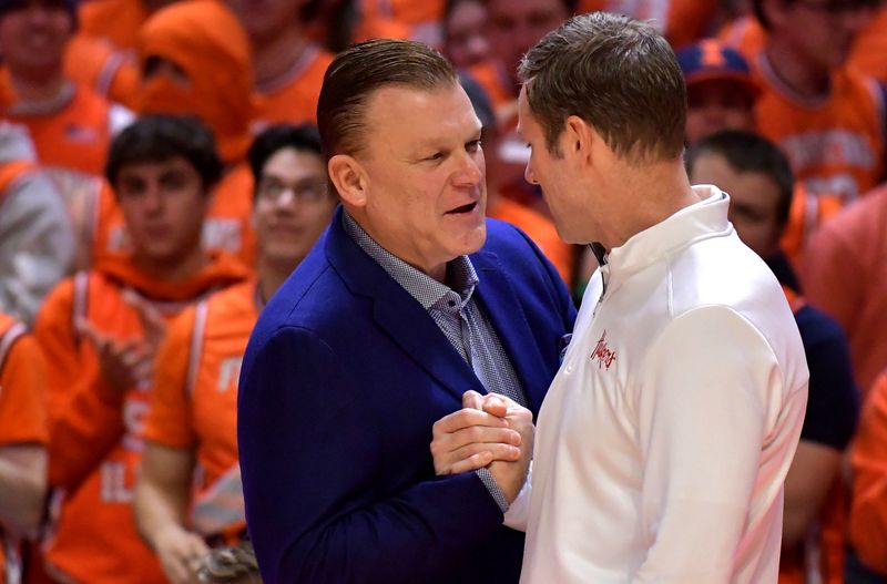 Jan 31, 2023; Champaign, Illinois, USA; Illinois Fighting Illini head coach Brad Underwood (left) and Nebraska Cornhuskers head coach Fred Hoiberg (right) shake hands before the game at State Farm Center. Mandatory Credit: Ron Johnson-USA TODAY Sports