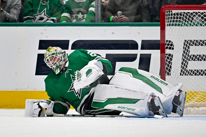 May 15, 2024; Dallas, Texas, USA; Dallas Stars goaltender Jake Oettinger (29) covers up the puck after a Colorado Avalanche shot during the second period in game five of the second round of the 2024 Stanley Cup Playoffs at American Airlines Center. Mandatory Credit: Jerome Miron-USA TODAY Sports