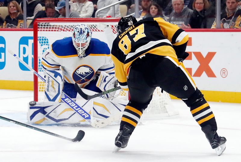 Oct 16, 2024; Pittsburgh, Pennsylvania, USA;  Buffalo Sabres goaltender Ukko-Pekka Luukkonen (1) makes a save against Pittsburgh Penguins center Sidney Crosby (87) during the third period at PPG Paints Arena. Mandatory Credit: Charles LeClaire-Imagn Images