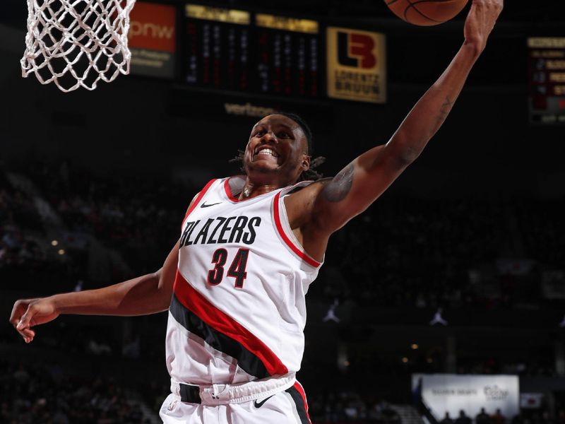 PORTLAND, OR - FEBRUARY 23: Jabari Walker #34 of the Portland Trail Blazers rebounds the ball during the game against the Denver Nuggets on February 23, 2024 at the Moda Center Arena in Portland, Oregon. NOTE TO USER: User expressly acknowledges and agrees that, by downloading and or using this photograph, user is consenting to the terms and conditions of the Getty Images License Agreement. Mandatory Copyright Notice: Copyright 2024 NBAE (Photo by Cameron Browne/NBAE via Getty Images)