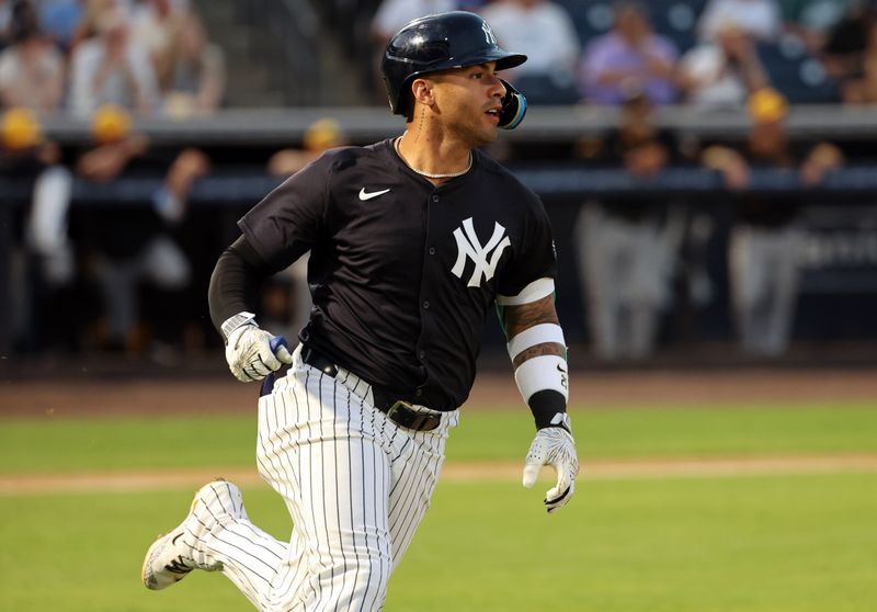 Mar 15, 2024; Tampa, Florida, USA; New York Yankees second baseman Gleyber Torres (25) hits a home run during the fourth inning against the Pittsburgh Pirates at George M. Steinbrenner Field. Mandatory Credit: Kim Klement Neitzel-USA TODAY Sports