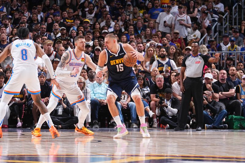 DENVER, CO - MAY 11: Nikola Jokic #15 of the Denver Nuggets dribbles the ball during the game against the Oklahoma City Thunder  during Round 2 Game 4 of the 2025 NBA Playoffs on May 11, 2025 at Ball Arena in Denver, Colorado. NOTE TO USER: User expressly acknowledges and agrees that, by downloading and/or using this Photograph, user is consenting to the terms and conditions of the Getty Images License Agreement. Mandatory Copyright Notice: Copyright 2025 NBAE (Photo by Bart Young/NBAE via Getty Images)