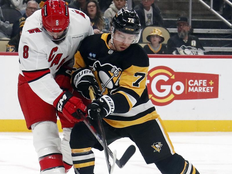 Oct 18, 2024; Pittsburgh, Pennsylvania, USA;  Carolina Hurricanes defenseman Brent Burns (8) and Pittsburgh Penguins left wing Anthony Beauvillier (72) battle for the puck during the third period at PPG Paints Arena. Mandatory Credit: Charles LeClaire-Imagn Images