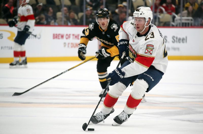 Dec 3, 2024; Pittsburgh, Pennsylvania, USA;  Florida Panthers center Carter Verhaeghe (23) skates up ice with the puck against the Pittsburgh Penguins during the third period at PPG Paints Arena. Mandatory Credit: Charles LeClaire-Imagn Images