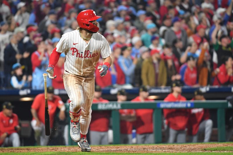 May 19, 2024; Philadelphia, Pennsylvania, USA; Philadelphia Phillies first base Bryce Harper (3) watches his game-winning sacrifice fly during the tenth inning against the Washington Nationals at Citizens Bank Park. Mandatory Credit: Eric Hartline-USA TODAY Sports