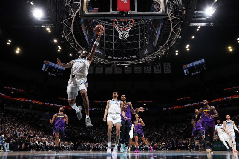 MINNEAPOLIS, MN - DECEMBER 2: Nickeil Alexander-Walker #9 of the Minnesota Timberwolves drives to the basket during the game against the Los Angeles Lakers on December 2, 2024 at Target Center in Minneapolis, Minnesota. NOTE TO USER: User expressly acknowledges and agrees that, by downloading and or using this Photograph, user is consenting to the terms and conditions of the Getty Images License Agreement. Mandatory Copyright Notice: Copyright 2024 NBAE (Photo by Jordan Johnson/NBAE via Getty Images)